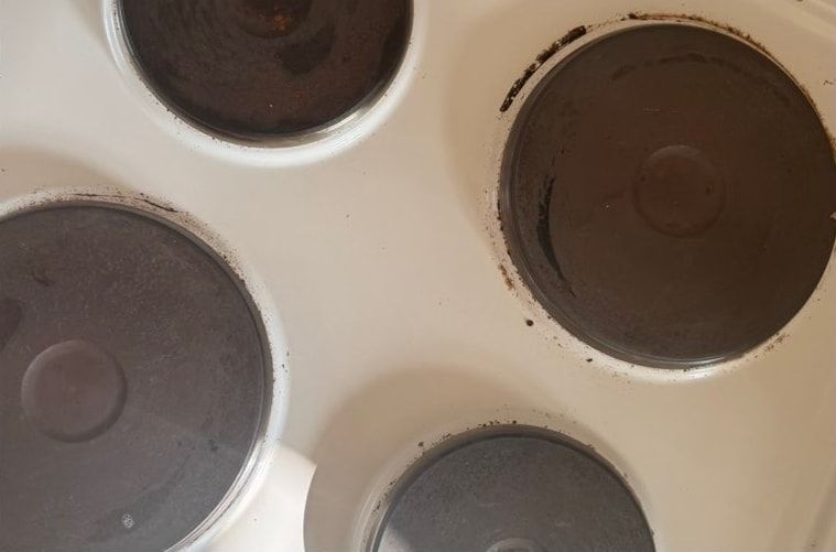 Before cleaning: close-up of electric hob rings